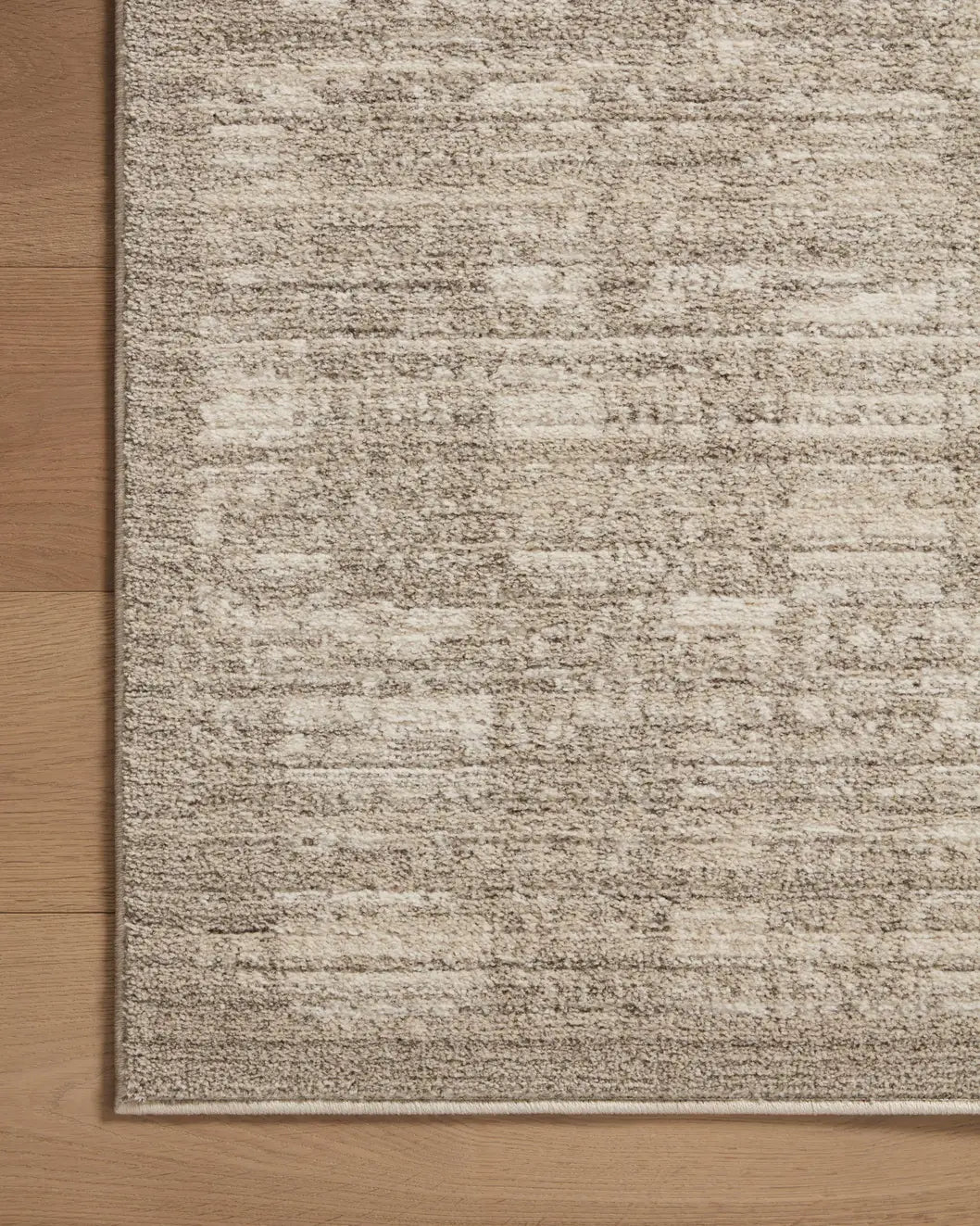 Loloi Darby Dar-07 Pebble/Sand Rug - corner on wood