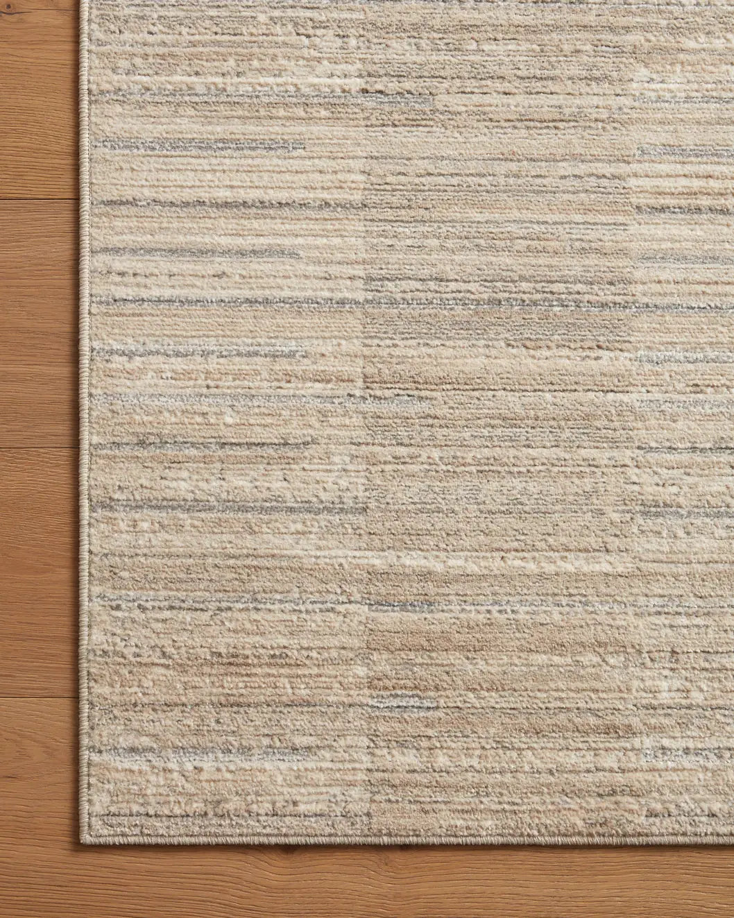 Loloi Arden Ard-01 Natural/Pebble Rug - corner on wood