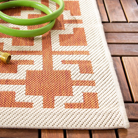 Safavieh Courtyard 5'-3" x 7'-7" Rug in Terracotta / Beige