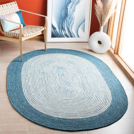 Safavieh Braided 5'-0" x 7'-0" Rug in Teal / Ivory
