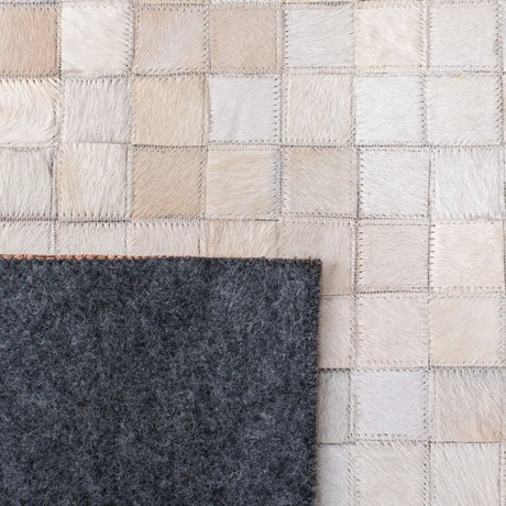 Safavieh Studio Leather 4'-0" x 6'-0" Rug in Beige / Brown