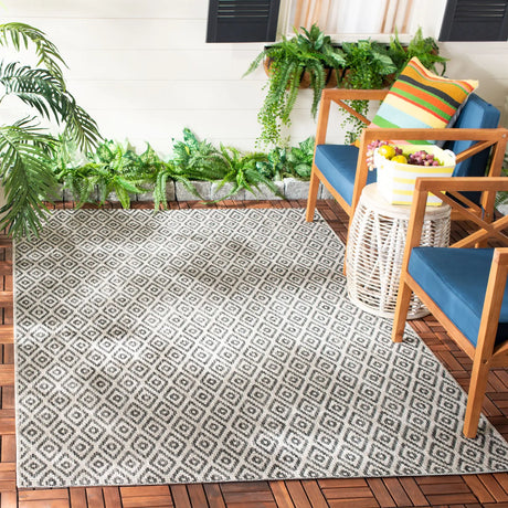 Safavieh Courtyard 5'-3" x 7'-7" Rug in Beige / Black