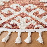 Safavieh Moroccan Tassel Shag 6'-7" x 6'-7" Rug in Orange / Ivory