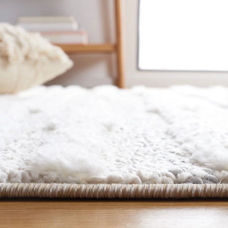 Safavieh Moroccan Tassel Shag 4'-0" x 6'-0" Rug in Beige / Ivory