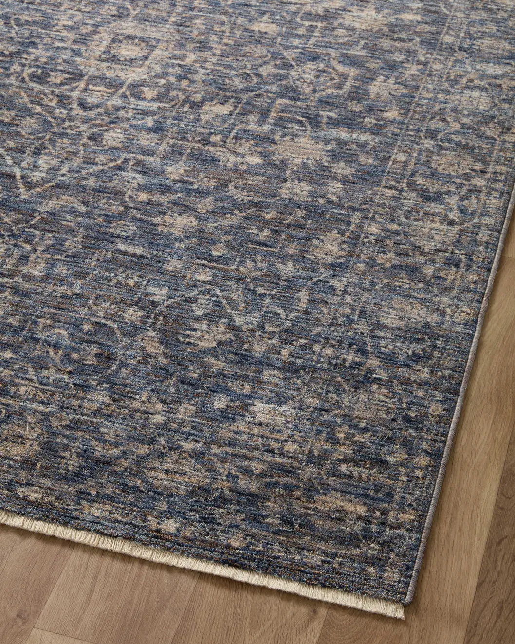 Loloi Sorrento Sor-01 Midnight/Natural Rug - angled corner on wood