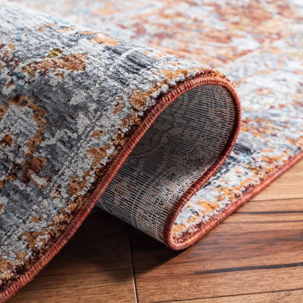 Safavieh Limitee 700 5'-0" x 8'-0" Rug in Beige / Rust