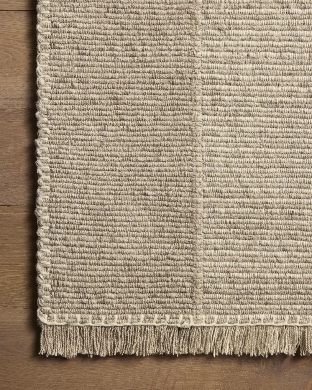 Loloi Sigrid SIG-02 Ash / Ivory Rug - corner on wood