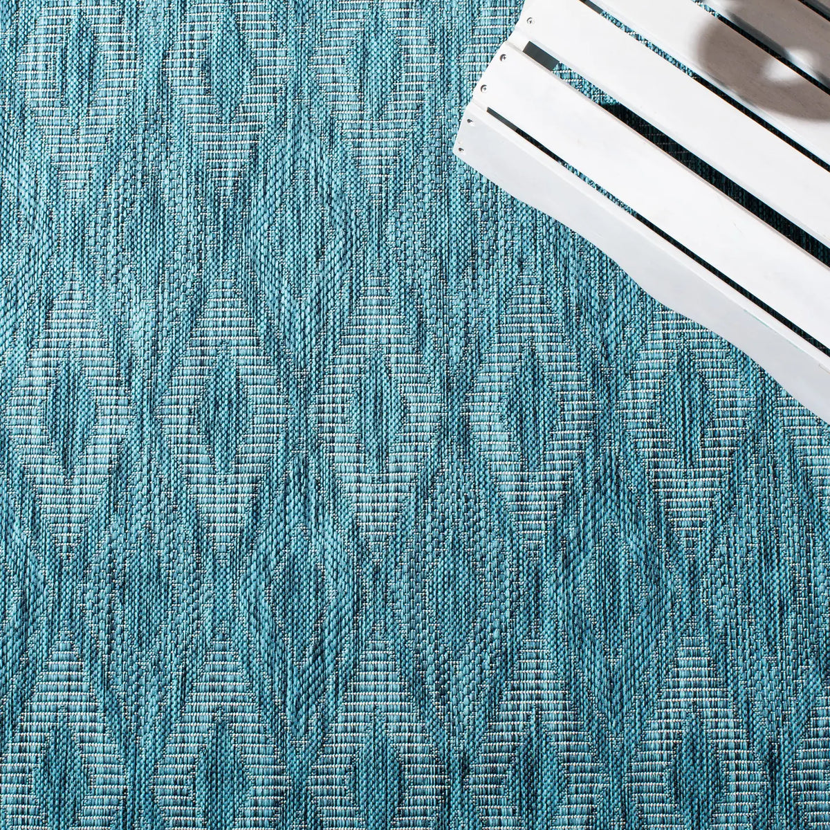 Safavieh Courtyard 4'-0" x 5'-7" Rug in Turquoise / Blue