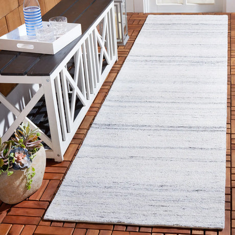 Safavieh Outdoor Micro-Loop 2'-3" x 9'-0" Rug in Ivory