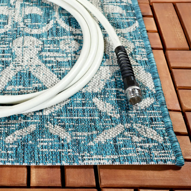 Safavieh Courtyard 6'-7" x 9'-6" Rug in Teal / Grey