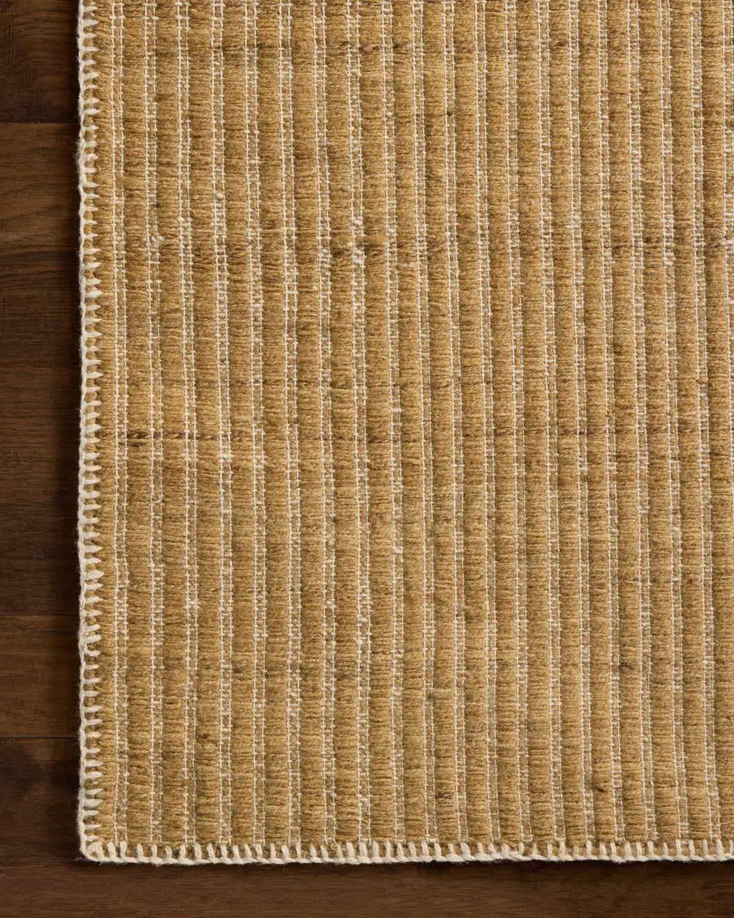 Loloi Elma ELM-01 Contemporary Hand Woven Wheat Rug - corner on wood