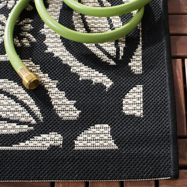 Safavieh Courtyard 5'-3" x 7'-7" Rug in Beige / Black