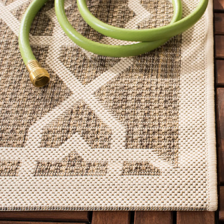 Safavieh Courtyard 5'-3" x 7'-7" Rug in Brown / Beige