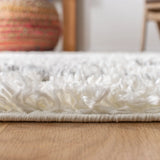 Safavieh Moroccan Tassel Shag 5'-3" x 7'-6" Rug in Ivory / Light Grey