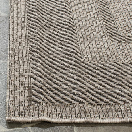 Safavieh Courtyard 5'-3" x 7'-7" Rug in Beige / Black