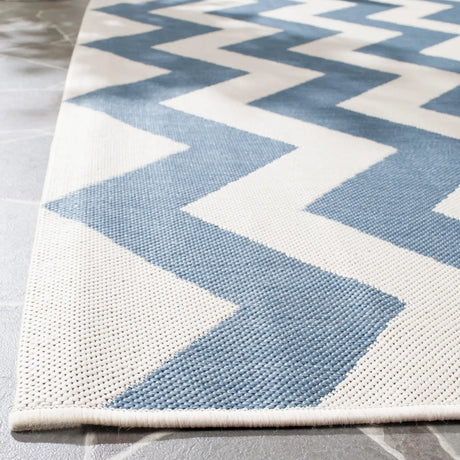 Safavieh Courtyard 6'-7" x 9'-6" Rug in Blue / Beige