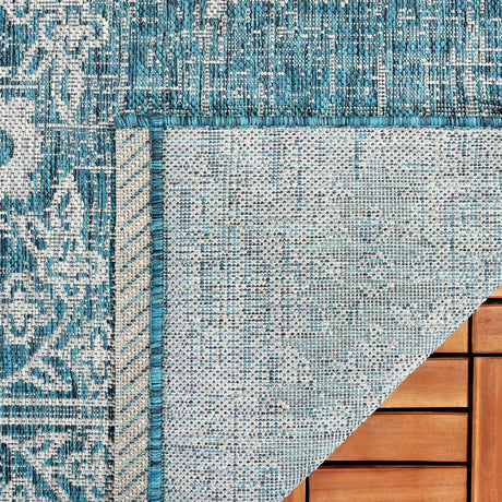 Safavieh Courtyard 6'-7" x 9'-6" Rug in Teal / Grey