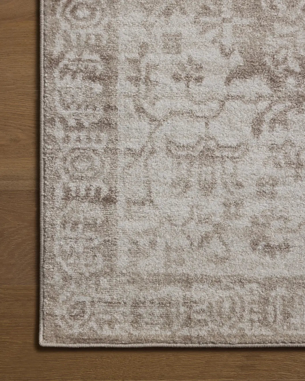 Loloi Lune LUN-05 Taupe / Ivory Rug - corner on wood