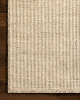 Loloi Elma ELM-01 Contemporary Hand Woven Bone Rug - corner on wood