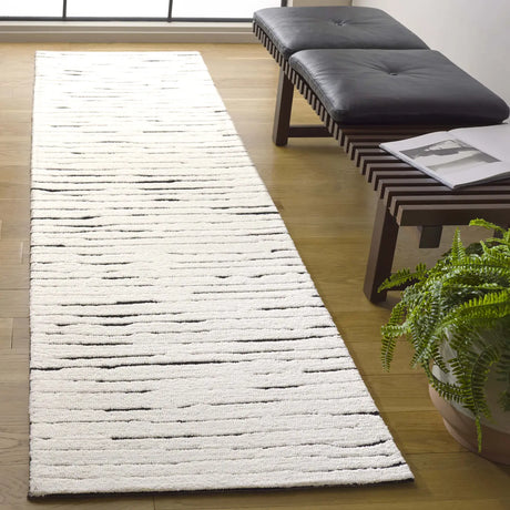 Safavieh Casablanca 2'-3" x 9'-0" Rug in Ivory / Black