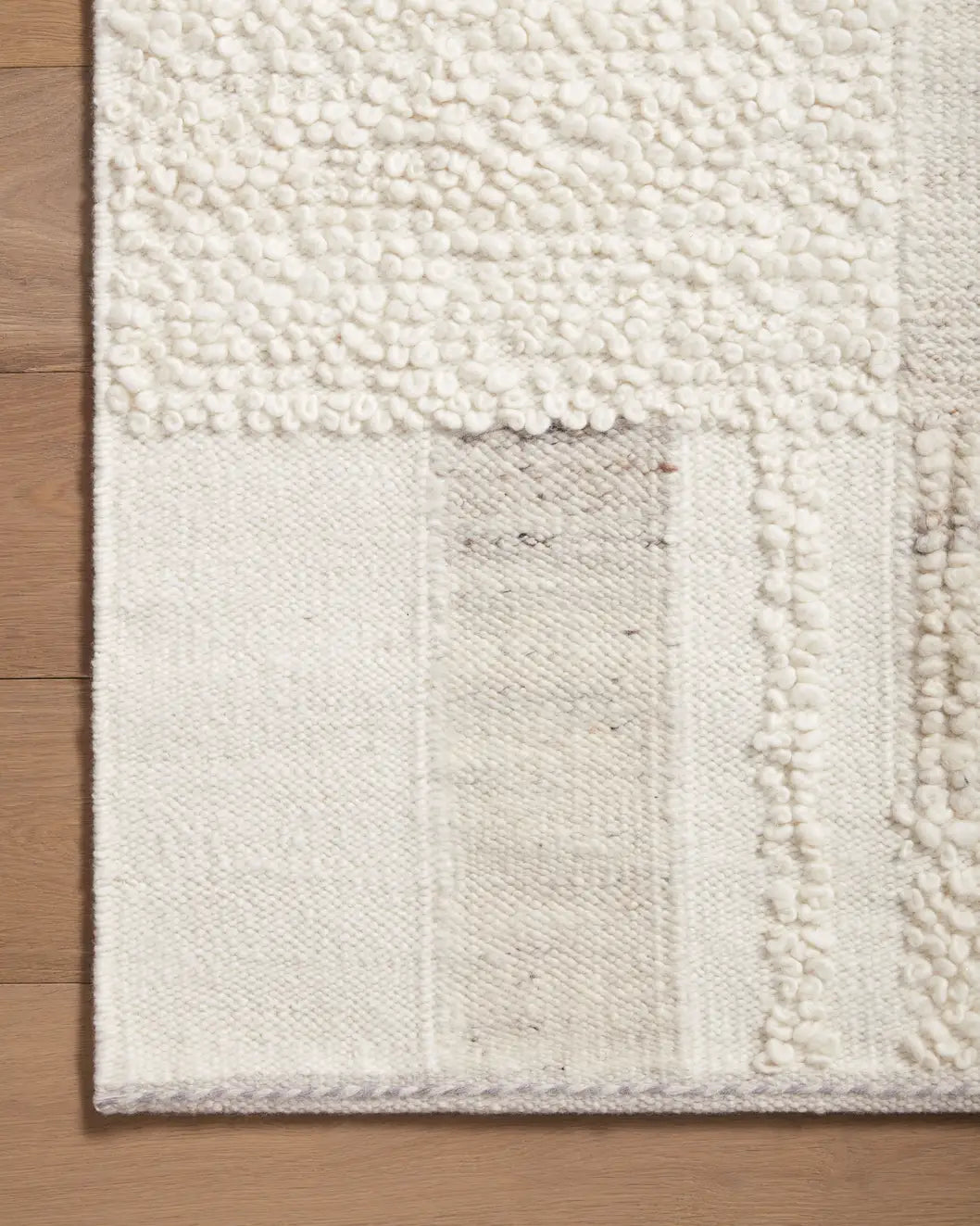 Loloi Manfred Man-01 Ivory/Pebble Rug - corner on wood