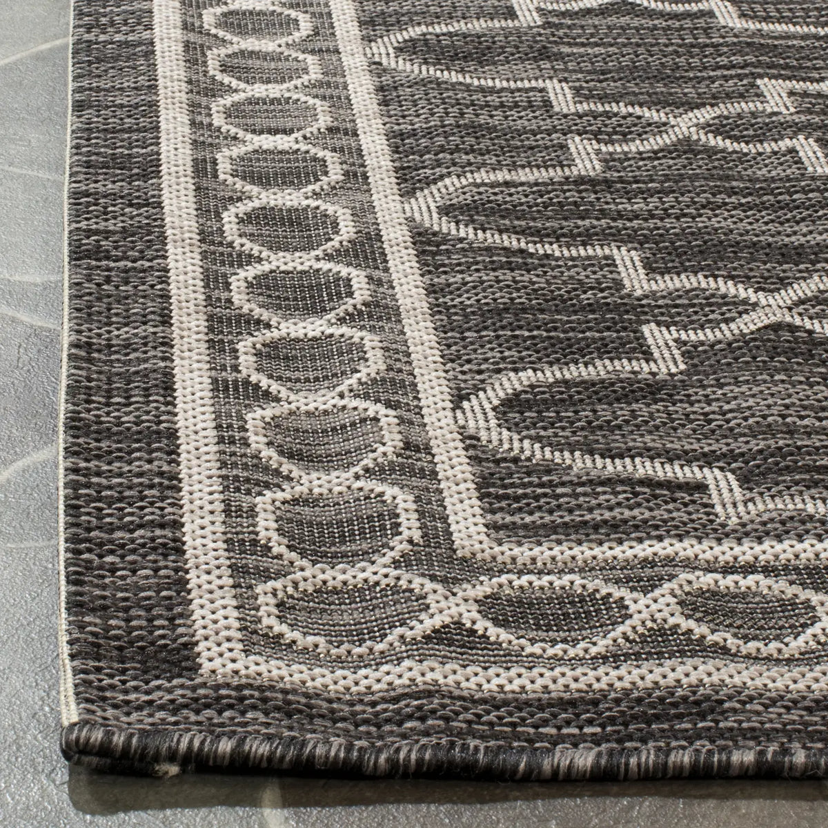 Safavieh Courtyard 5'-3" x 7'-7" Rug in Black / Beige