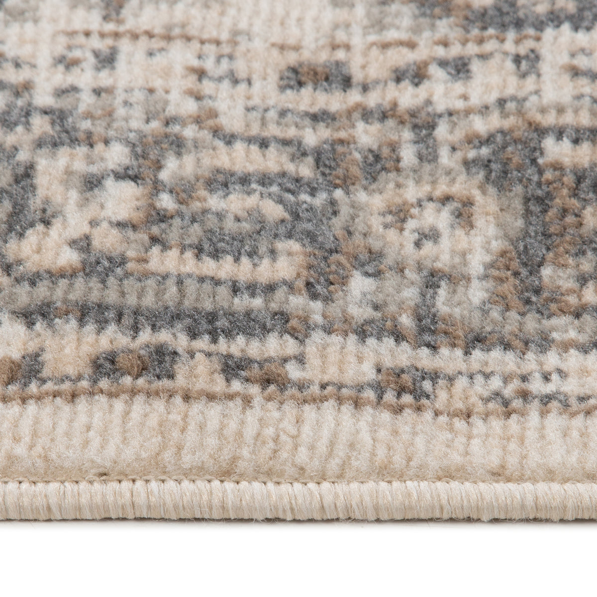 Light beige traditional medallion area rug with blue-gray geometric pattern; fringed border.