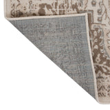 Rectangle rug corner with stitched border and patterned face over blue-gray backing.
