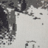Abstract area rug detail in ivory and dark gray with geometric pattern texture.