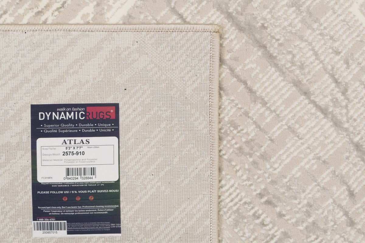 Modern power-loomed rug in ivory with light grey geometric pattern and stitched border