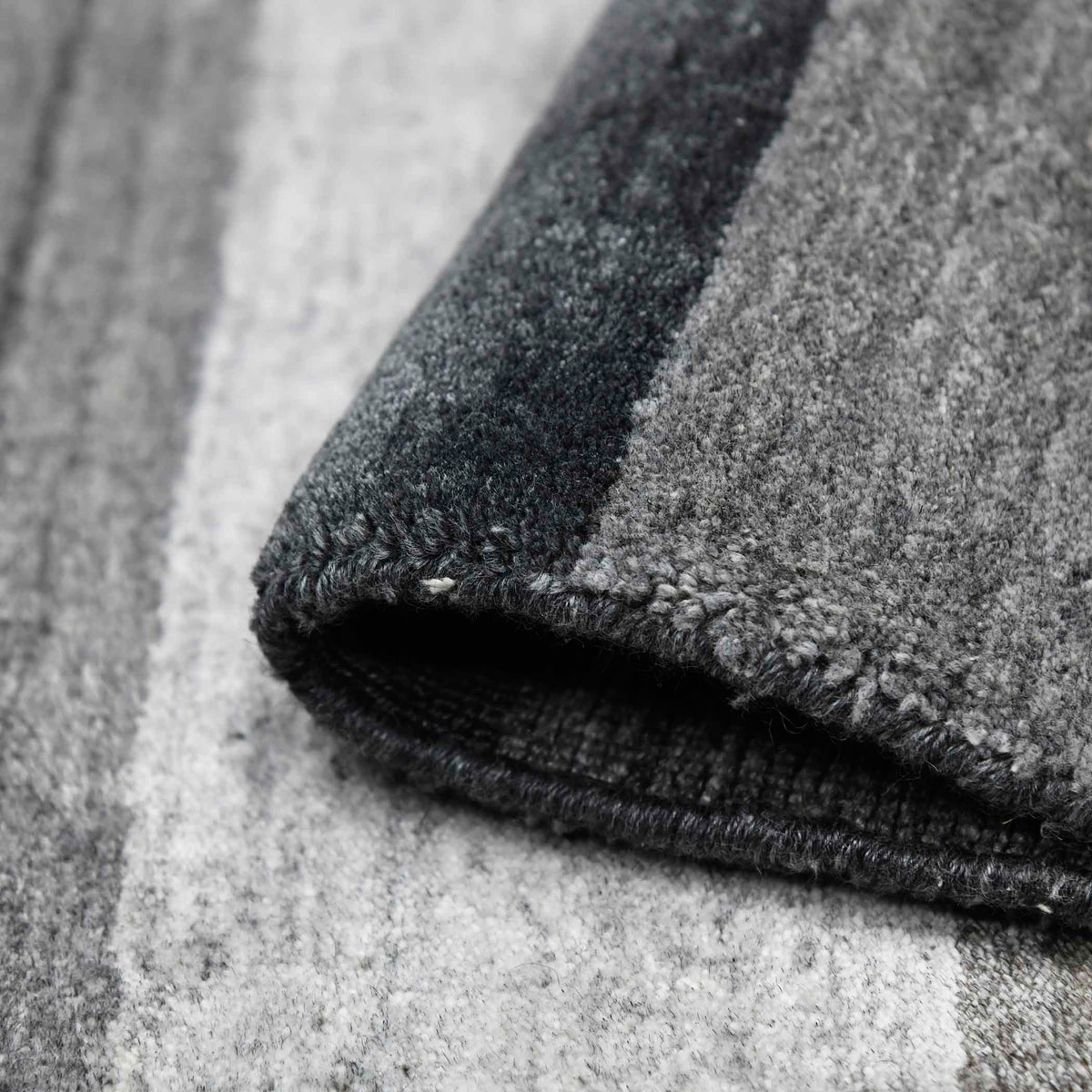 Amer Blend BLN-15 Charcoal area rug - rolled view