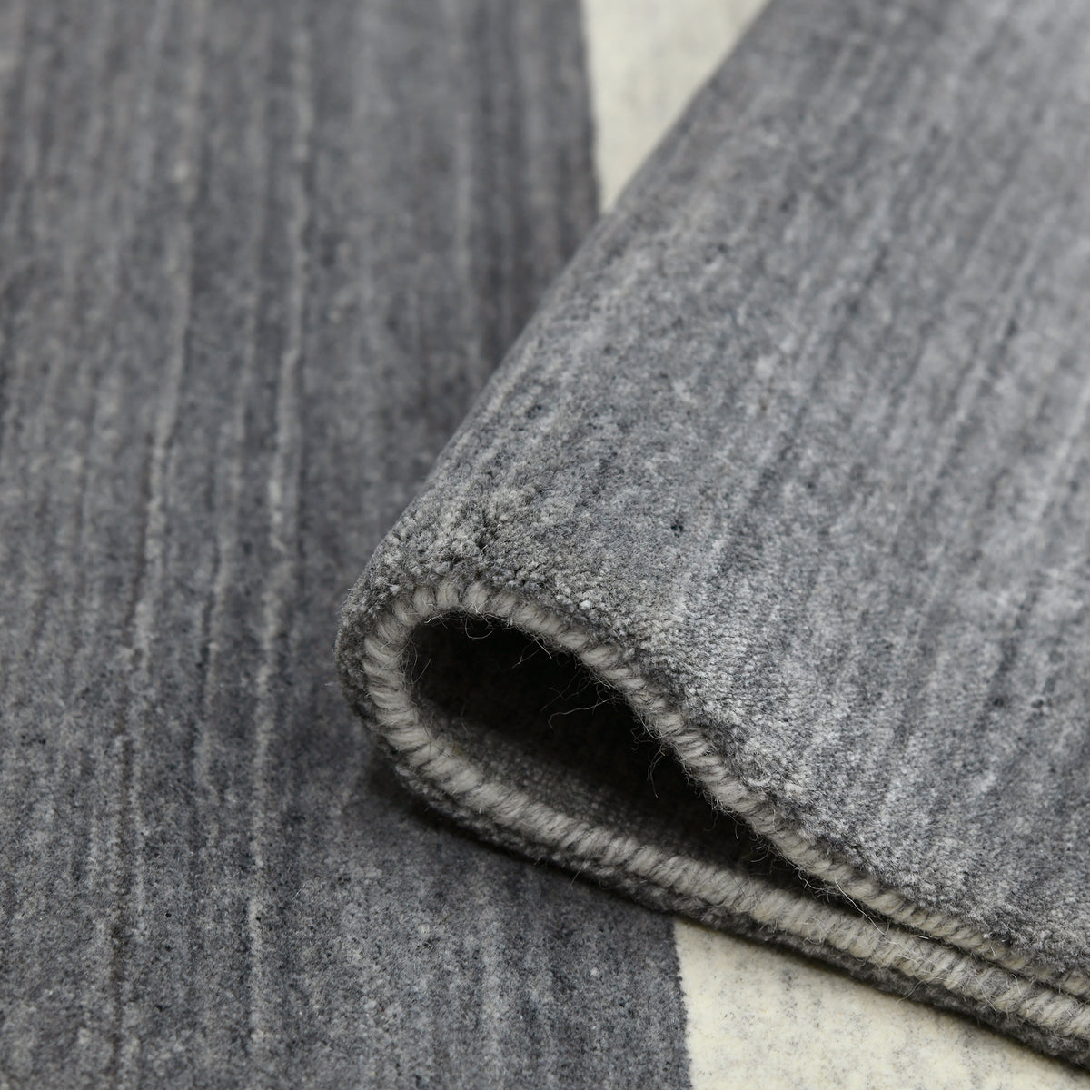Amer Blend BLN-5 Charcoal area rug - rolled view