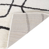 Ivory power-loom area rug with geometric Moroccan lattice lines and serged edge