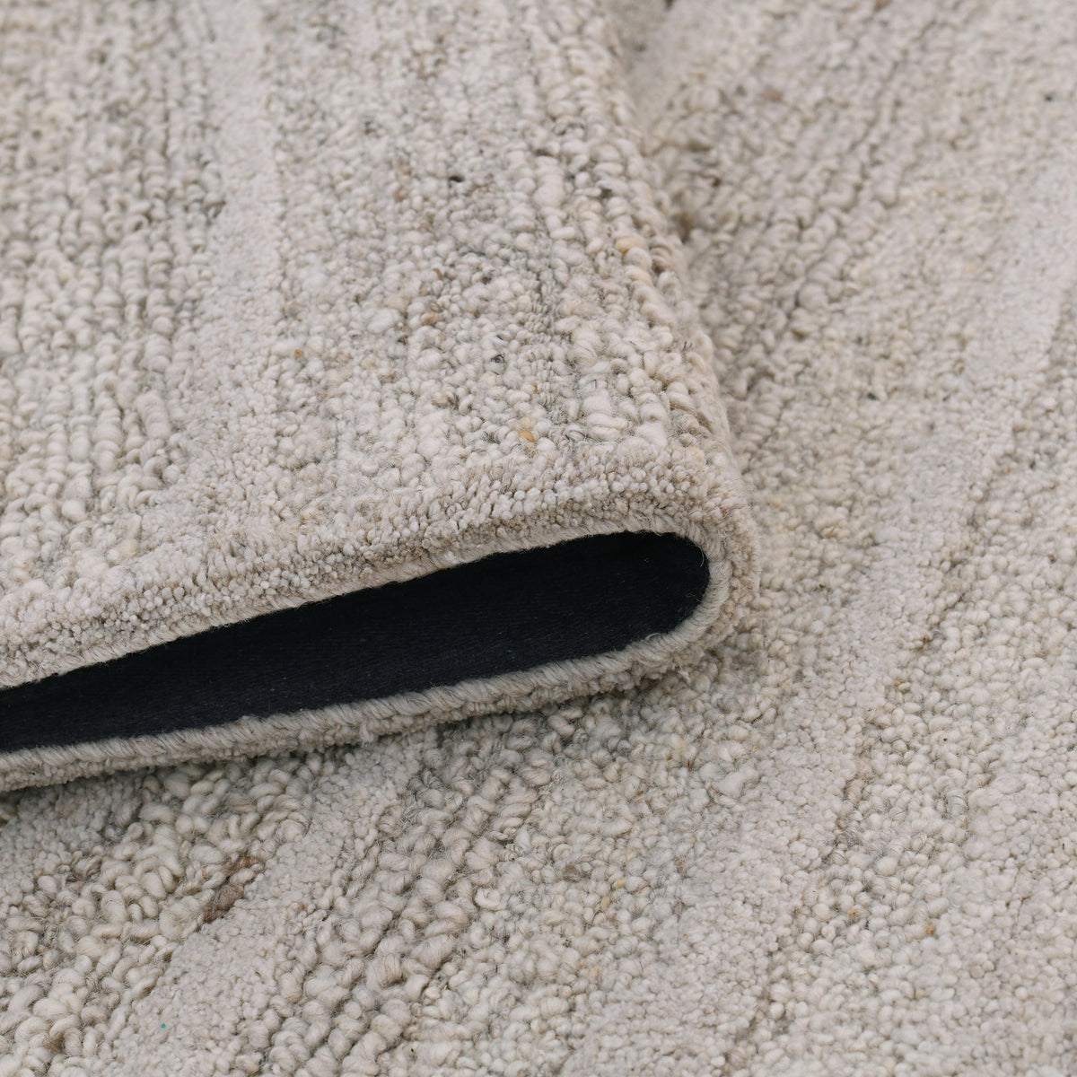 Amer Nimbus NIM-3 Beige area rug - rolled view