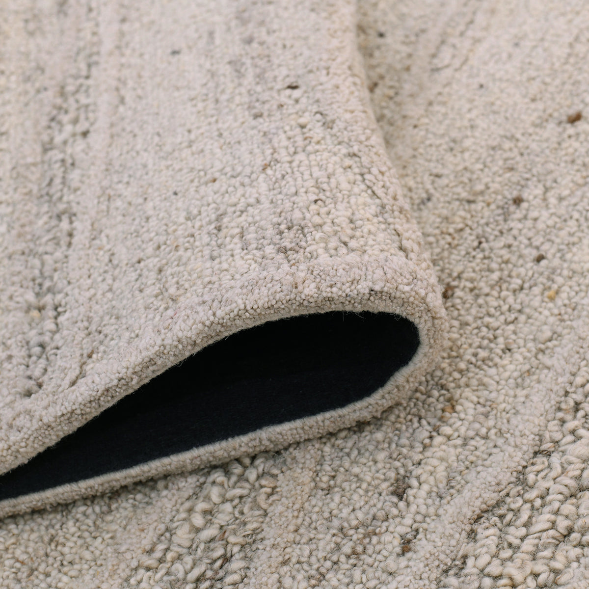 Amer Nimbus NIM-8 Beige area rug - rolled view