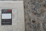 Transitional area rug with distressed navy and beige pattern, rectangle