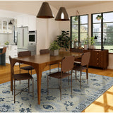 Light blue floral hand-hooked area rug with decorative navy pattern, rectangle