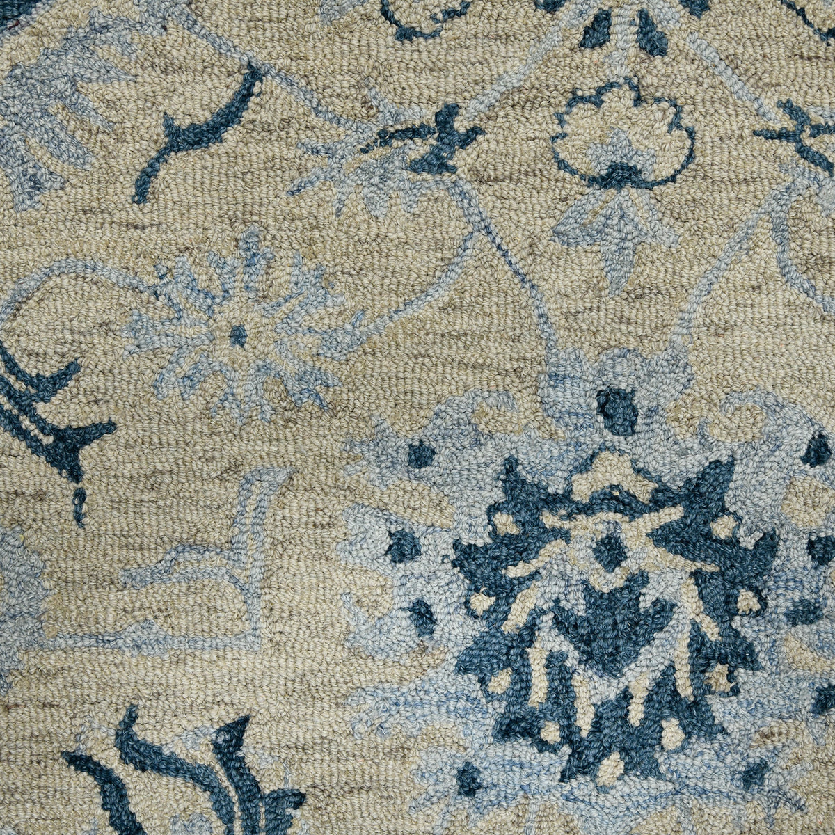 Light blue floral area rug field with cream background and navy floral medallion