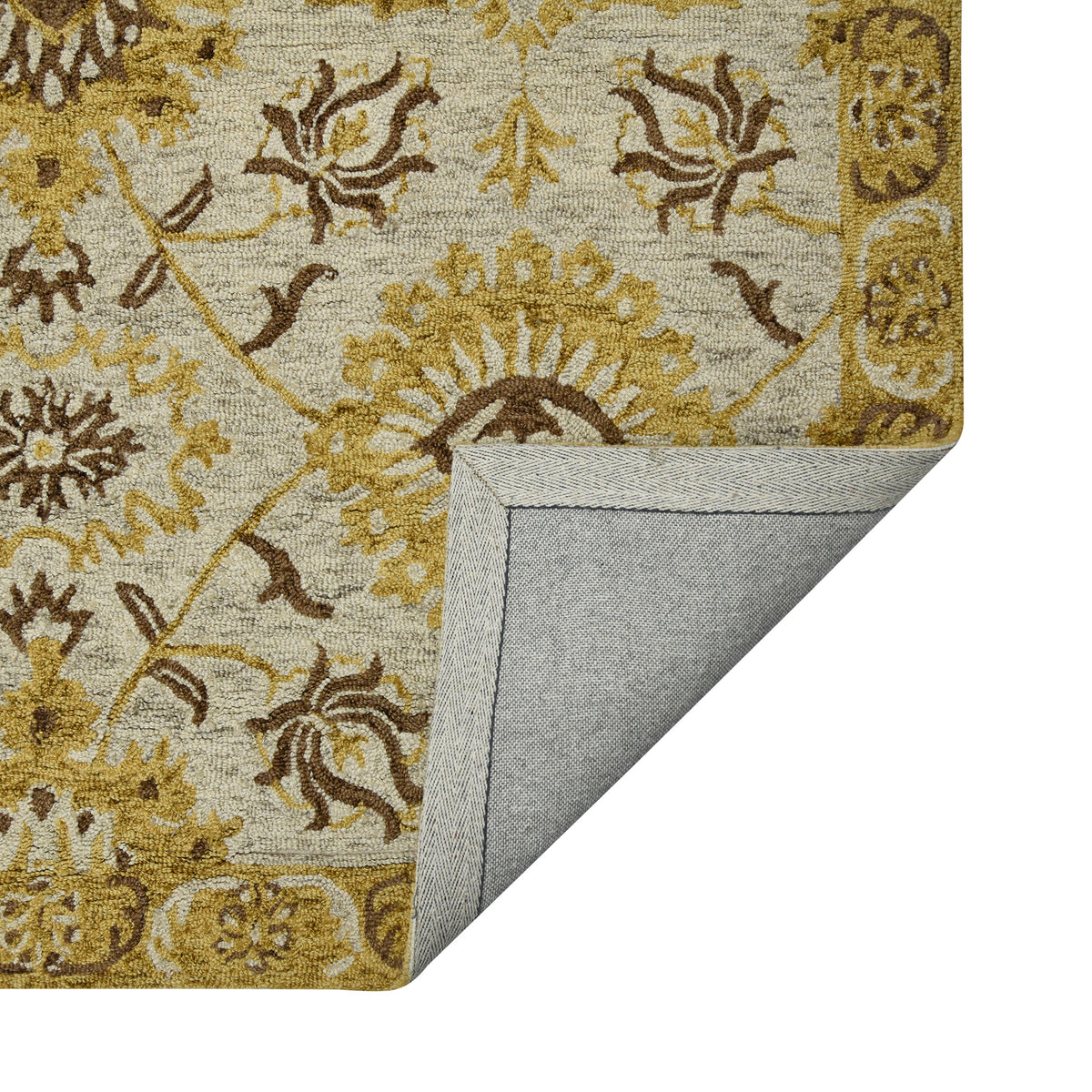 Folded floral area rug with beige fabric, gold detailing, and stitched border