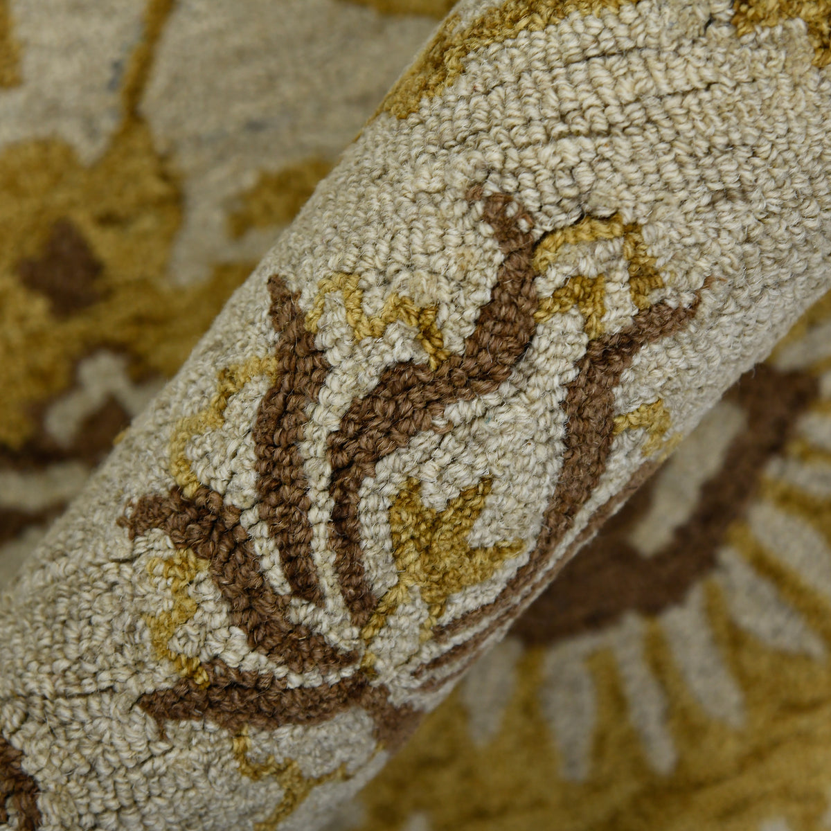 Hand-hooked floral area rug with beige ground and gold-brown curving vines