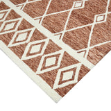 Rust geometric area rug with cream outlined star and lattice motif