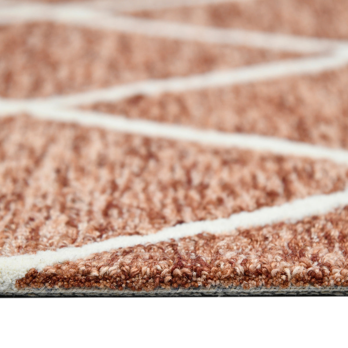 Hand-hooked rust area rug with cream geometric lines and short textured pile