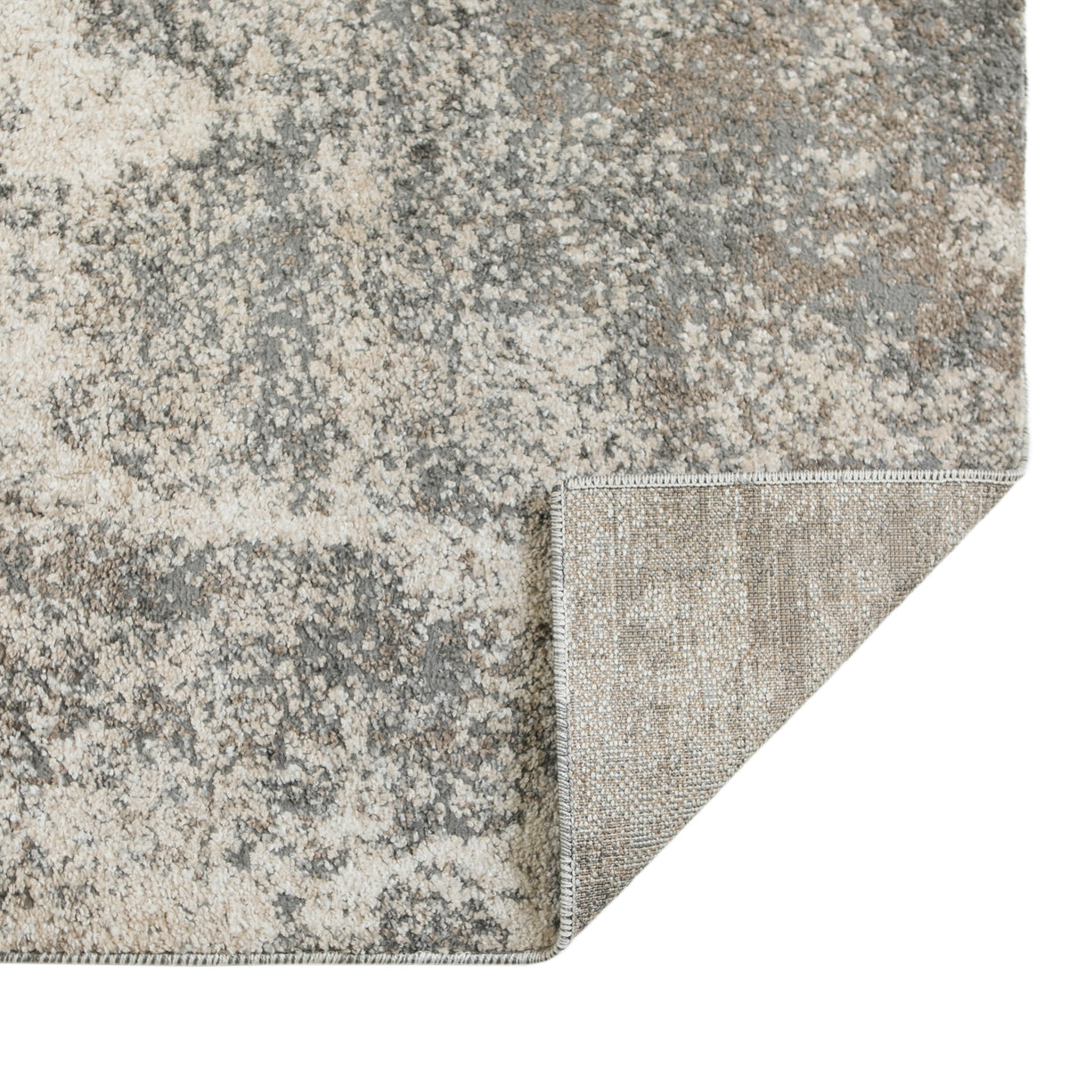 Gray and beige area rug, corner view with stitched edge and short pile texture.