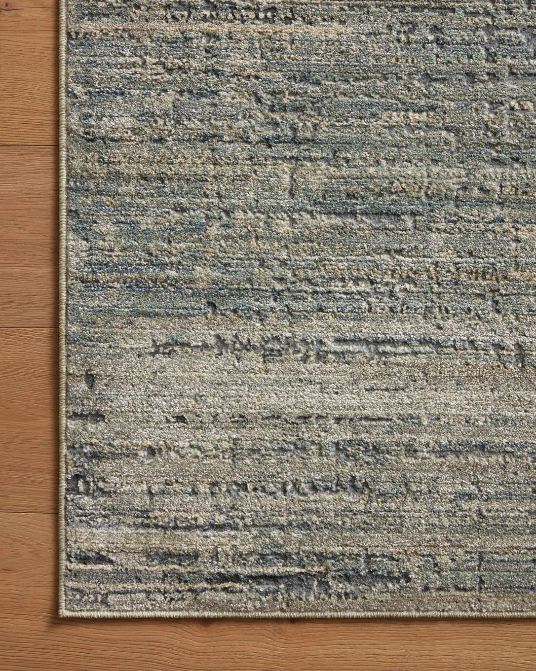 Loloi Arden Ard-03 Lagoon/Sage Rug - corner on wood