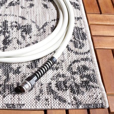 Safavieh Courtyard 5'-3" x 7'-7" Rug in Black / Beige