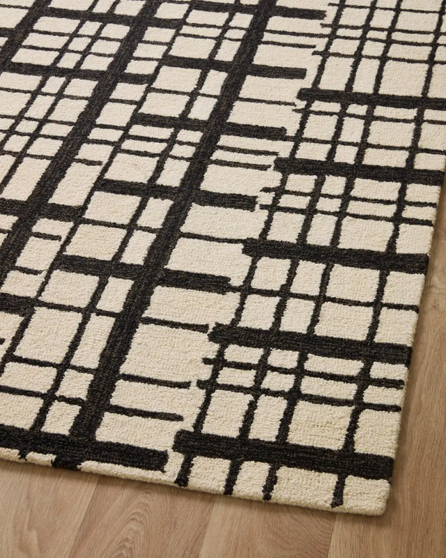 Chris Loves Julia x Loloi Polly POL-02 Black / Ivory Rug - angled corner on wood