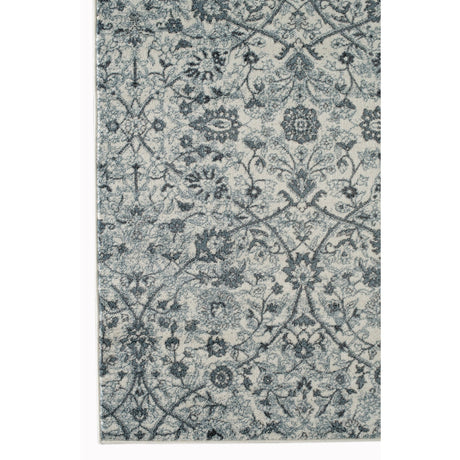 Light blue floral power-loom area rug with ornate medallion and scroll pattern