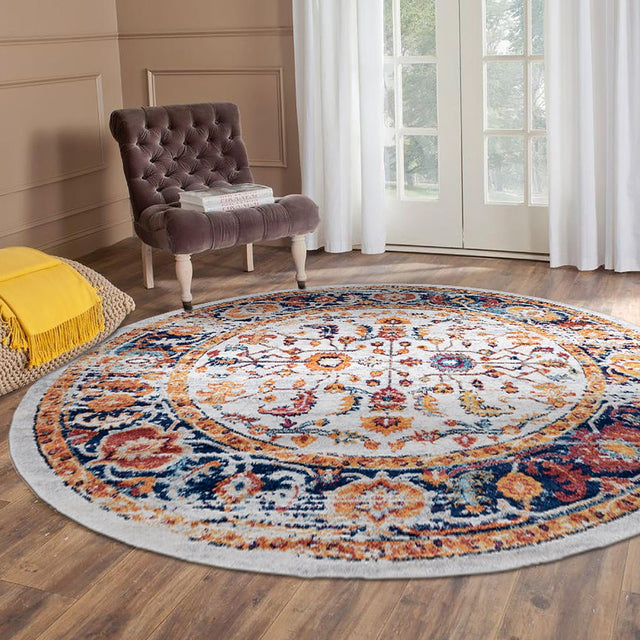 Round ivory area rug with multicolor vintage medallion and floral border trim.