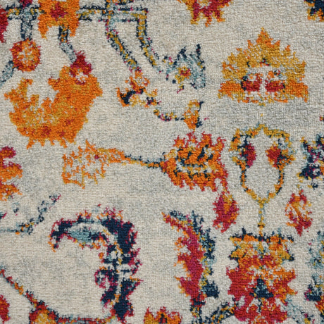 Ivory area rug with multicolor vintage medallion and ornate border pattern.