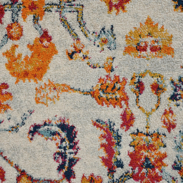Ivory area rug with multicolor vintage medallion and ornate border pattern.